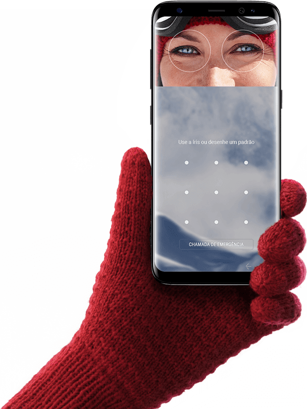 Hand wearing glove holding up Galaxy S8 for iris scanning